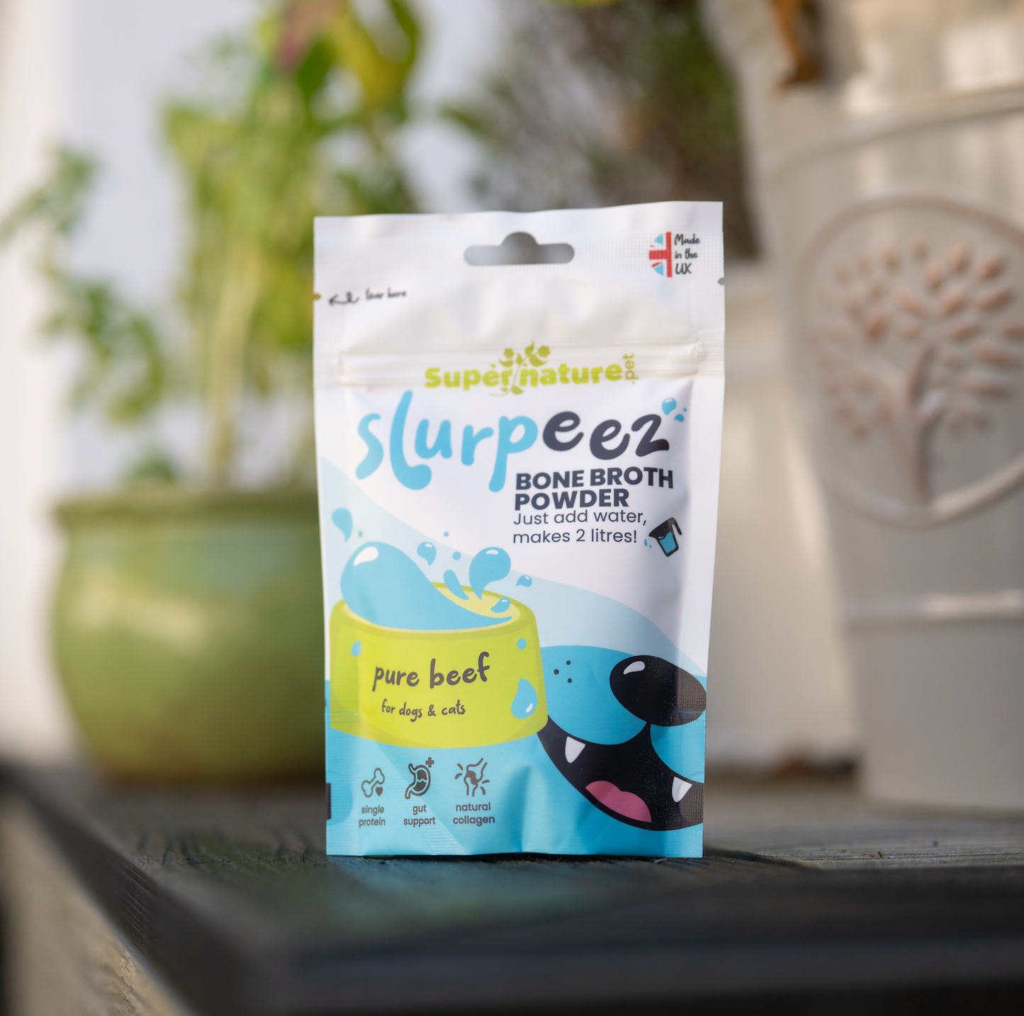 Beef bone broth by Slurpeez on outdoor background