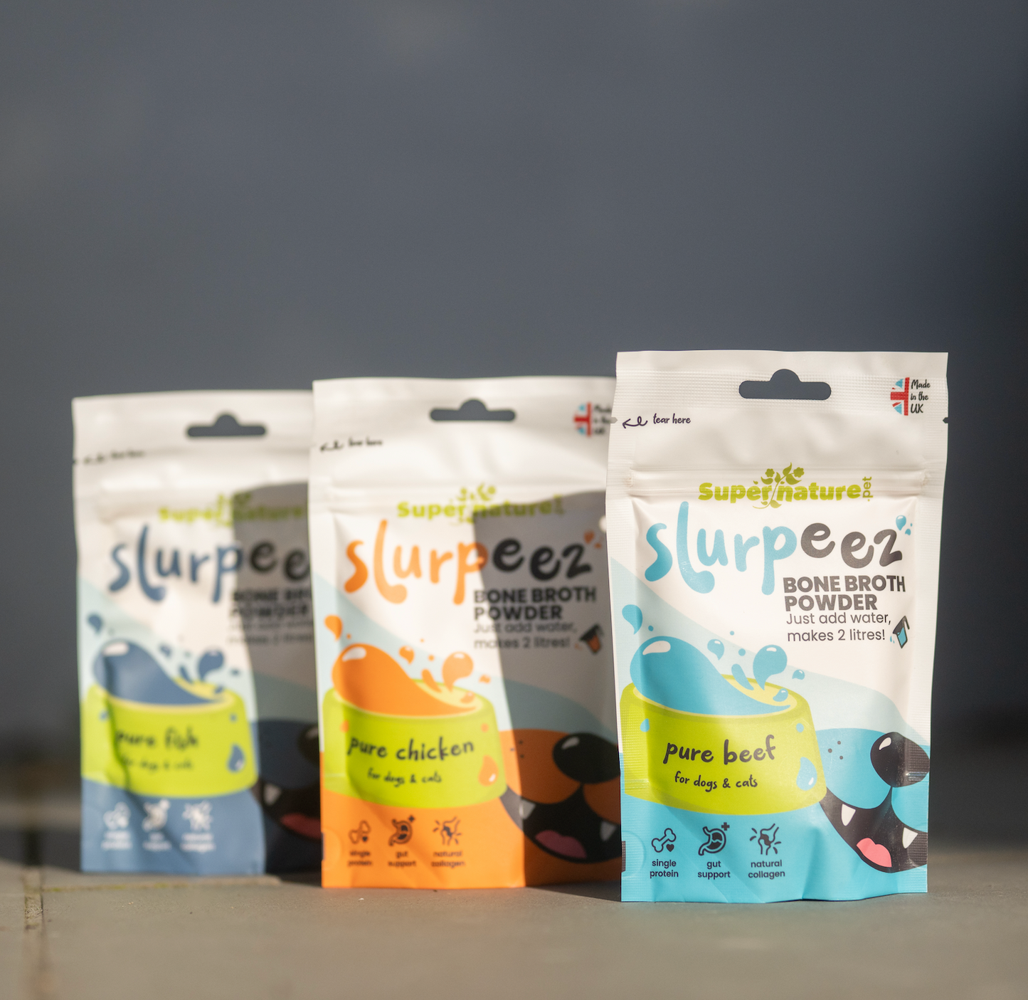 Slurpeez Bone Broth Powder in three flavors: chicken, beef, and fish, perfect for dogs and cats.