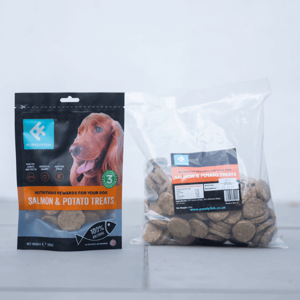 2 bags of purely fish salmon and potato treats on a grey background