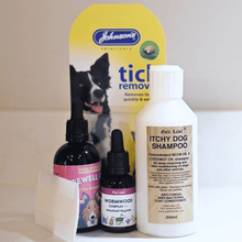 Natural flea and worm treatment bundle with dog shampoo, herbal drops, comb, and tick remover for dogs.