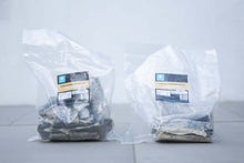 Two clear bags of Cod Skin Flatties for dogs, showcasing healthy, natural dog treats.