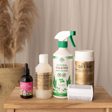 Collection of pet care product included in Bye Bye Fleas bundle on a wooden table with a neutral background