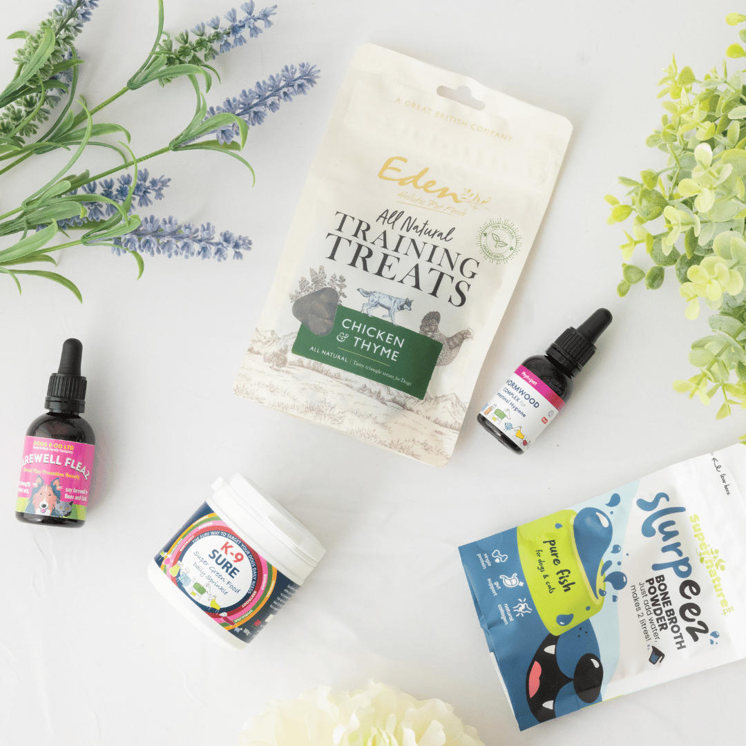 Wormwood complex, K9 Sure, Eden training sheets, Slurpeez bone broth shown on a white background with lavender and foliage 