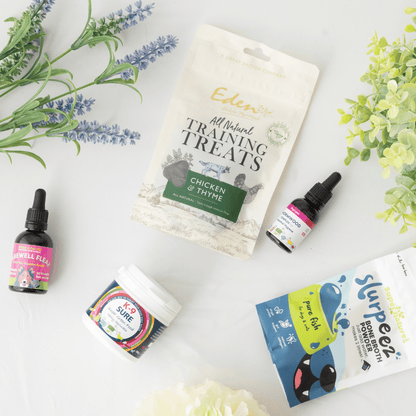 Wormwood complex, K9 Sure, Eden training sheets, Slurpeez bone broth shown on a white background with lavender and foliage 