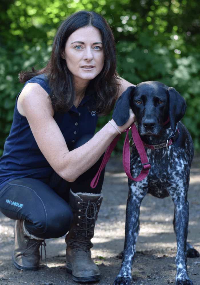 Aisling Armitage, owners of Canine Natural Cures sitting next to her dog Chloe