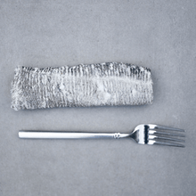 Natural cod skin flatties for dogs with a fork, showcasing a healthy pet treat option.