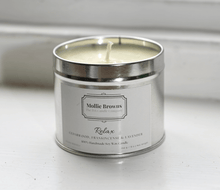 Pet friendly scented candle in a tin by Mollie Browns, made with natural soy wax and essential oils.