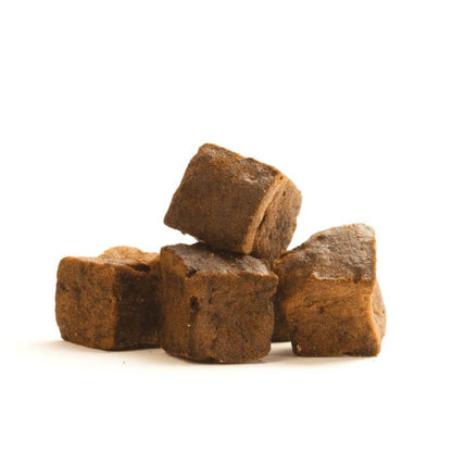 Luxury liver brownies for dogs, gourmet pet treats stacked on a white background.