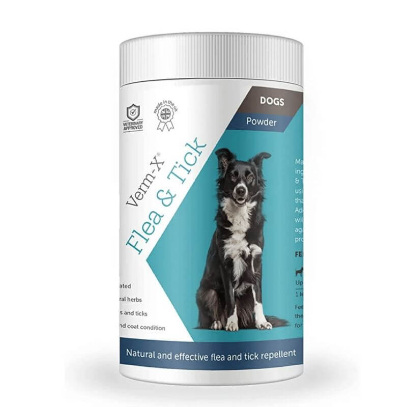 Natural Verm-X Flea & Tick Powder for dogs in a white container with black dog image on label.